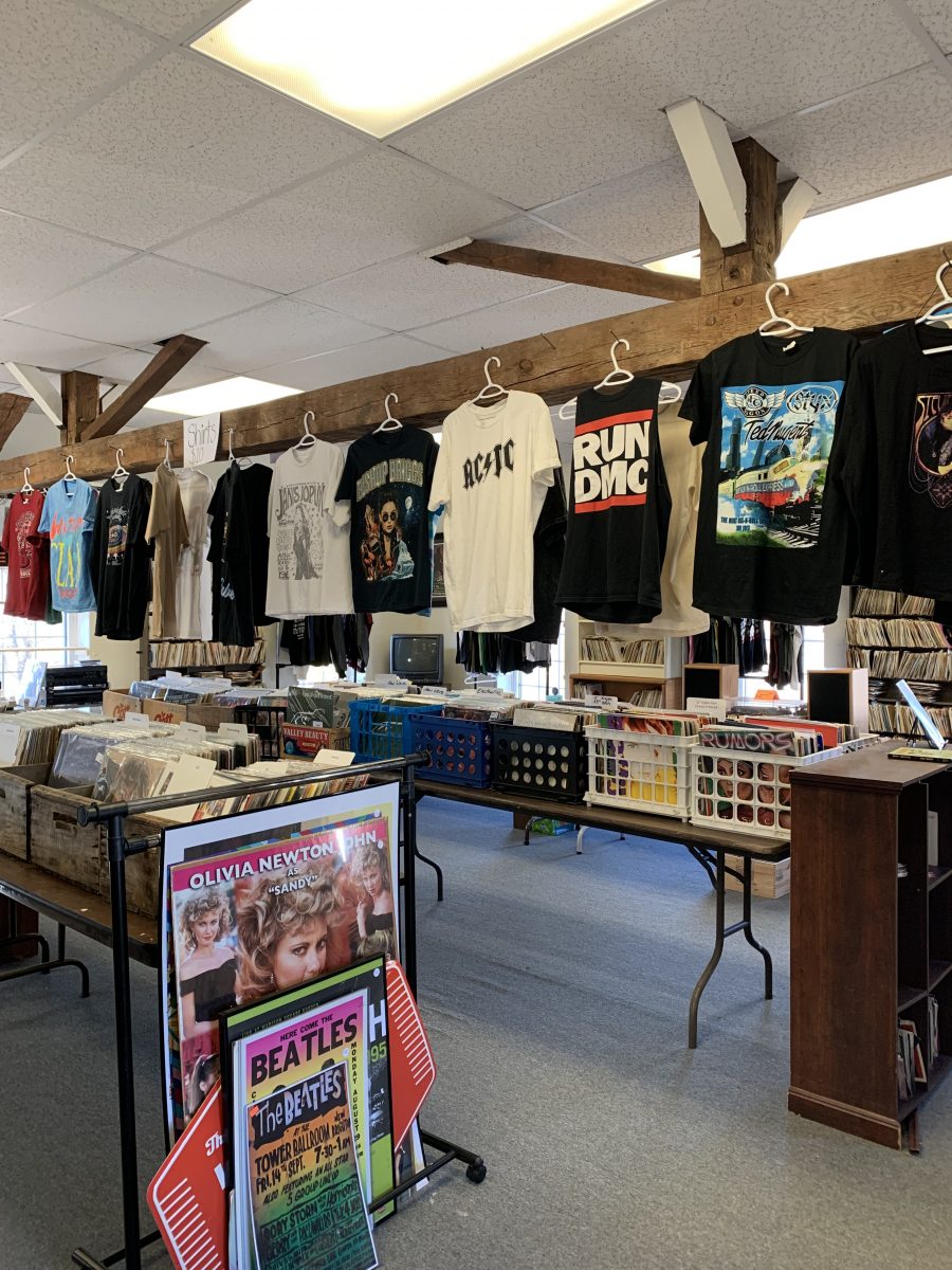 T-shirts and other memorabilia displayed in CBug's Records.