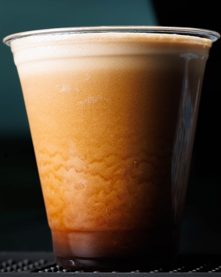 A full cup of coffee from a TapThat vending machine