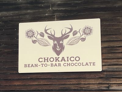 The logo of Chokaico Bean-to-bar chocolate on a sign.