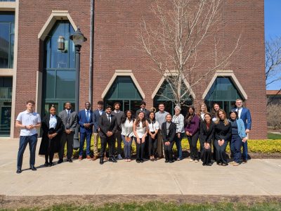 A group of UConn students, professors, CTSBDC advisors, and Cricket Press staff on campus