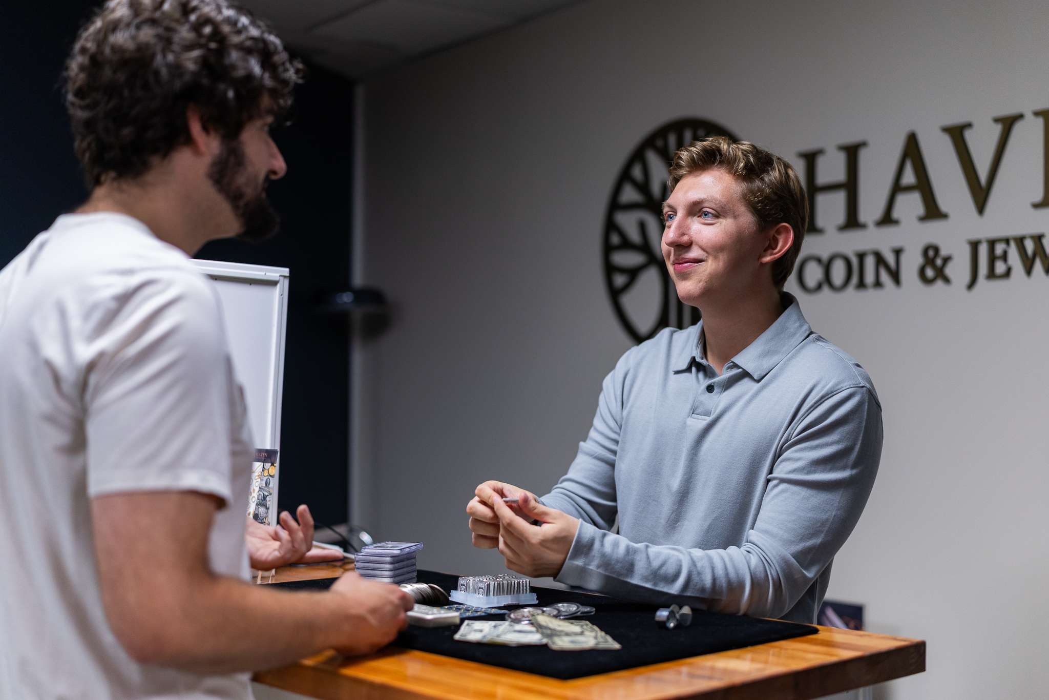 Matt Pavia from Haven Coin & Jewelry talking to a customer