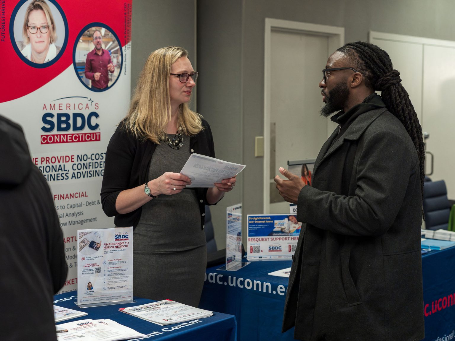 Three people smiling at the camera during the the SBA Lending Expo